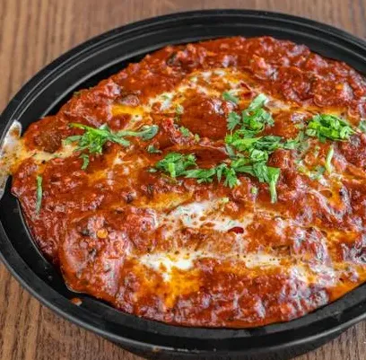 Deep-fried chimichangas with guacamole and sour cream at Carlos and Murphys Winnipeg